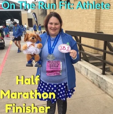 Rebecca beaming at her first half-marathon finish.